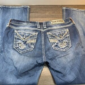 Rock Revival Distressed Blue Jeans with Embroidered Pockets